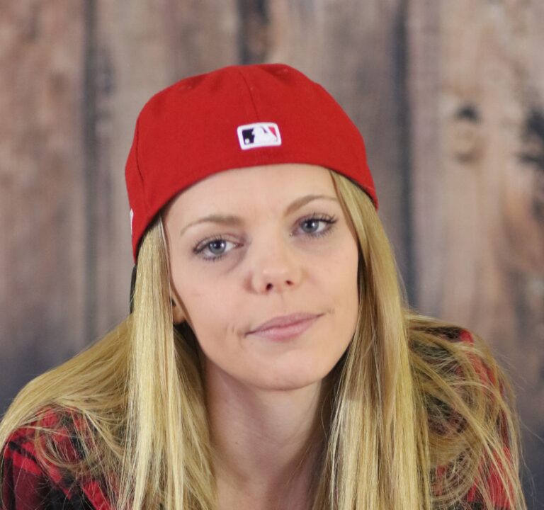 Sienna Frost headshot with baseball cap on backwards