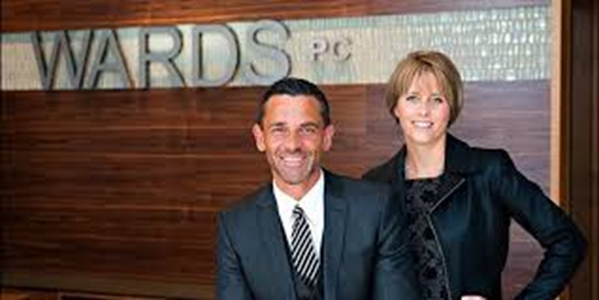Ward Legal lawyers in front of sign
